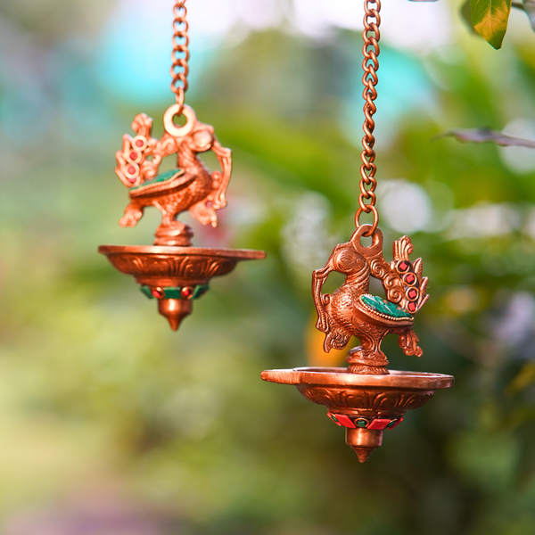 Mayura Tara Small Hanging Diyas – Vibrant Green & Red Brass Peacock Oil Lamps for Pooja & Home Decor