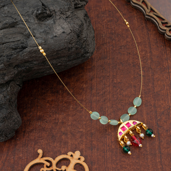 Chandrika; Brass necklace with Kundan work, Crescent Moon pendant and Floral Motif Indian jewellery