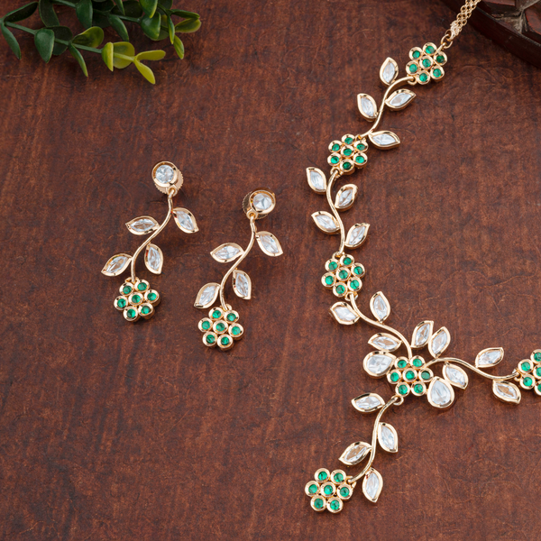 Rajkumari Harita; Brass Kundan necklace set, Floral Leaf design with green stones and Carat plating